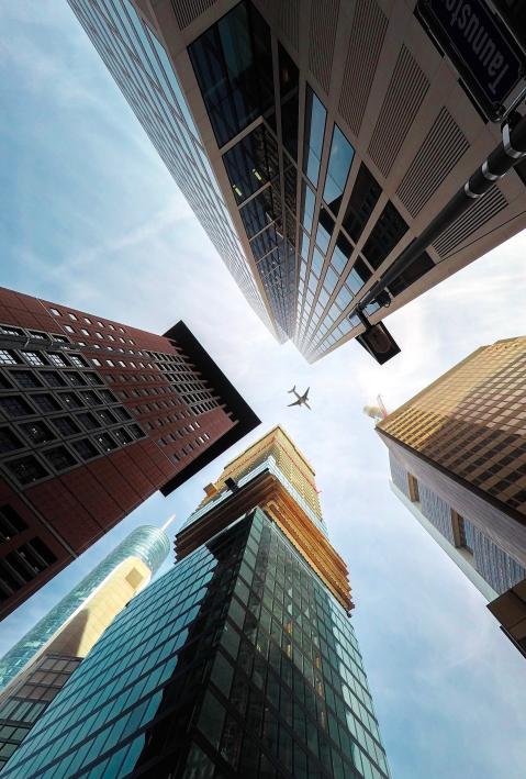 Frankfurt am Main Skyscraper low angle looking up to a plane in the sky