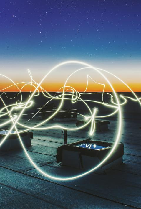 adelphi theme energy, roof with night sky and light beams