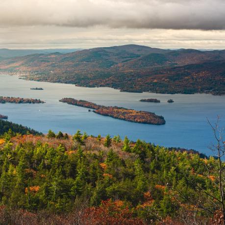 Depiction of a water body in a mountainous landscape.