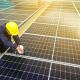 worker on solar panel